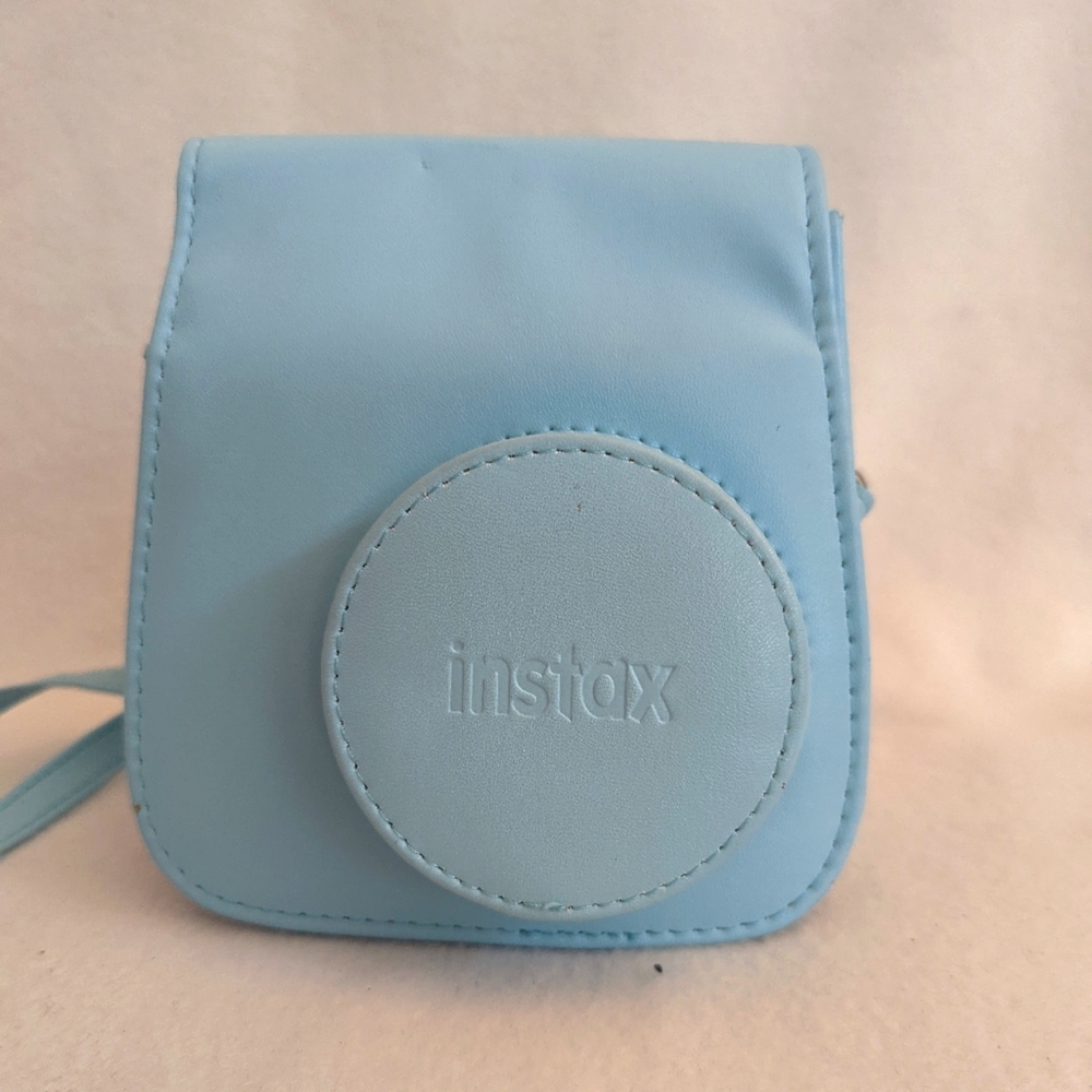 Instax camera case. A soft blue bag would be a great addition to a camera gift.